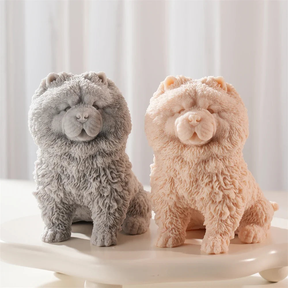 Gray and peach fluffy Chow Chow dog candle figures sitting side by side