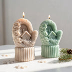 Two mitten-shaped candles showing the cottage framed by sculpted roses