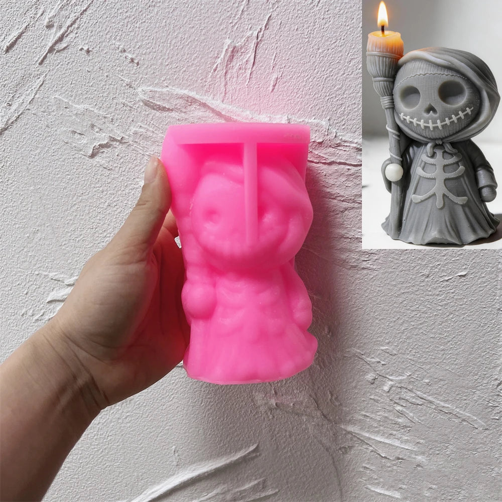 Pink hooded-skeleton silicone candle mold with a gray casting inset