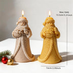 Long-robed Santa Claus candle figures with textured robes and gift details