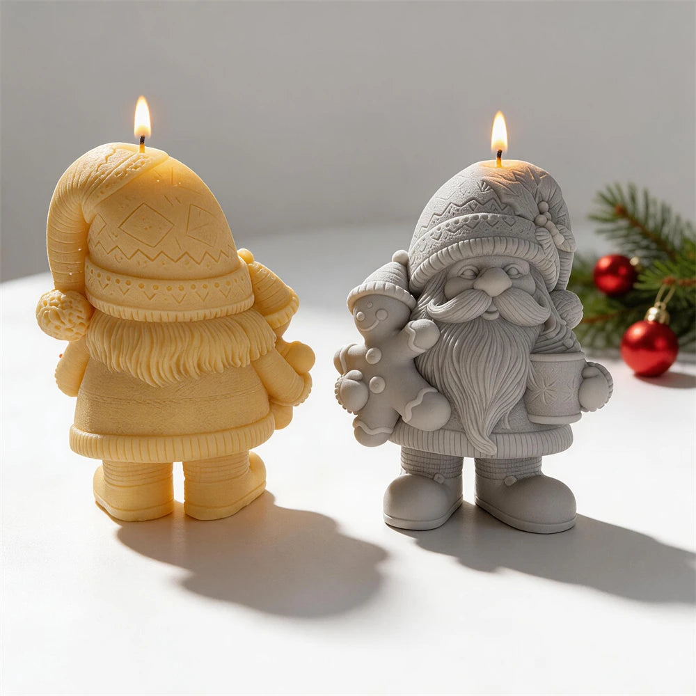 Rear view of yellow gnome casting beside a front-facing gray gnome with gingerbread and mug