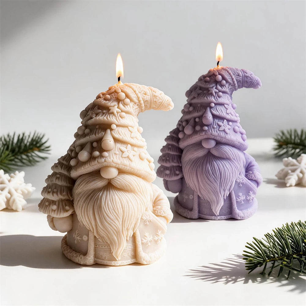 Cream and lilac tree hat gnome candles beside snowflake props