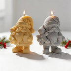 Christmas gnome candles holding gingerbread figures and mugs