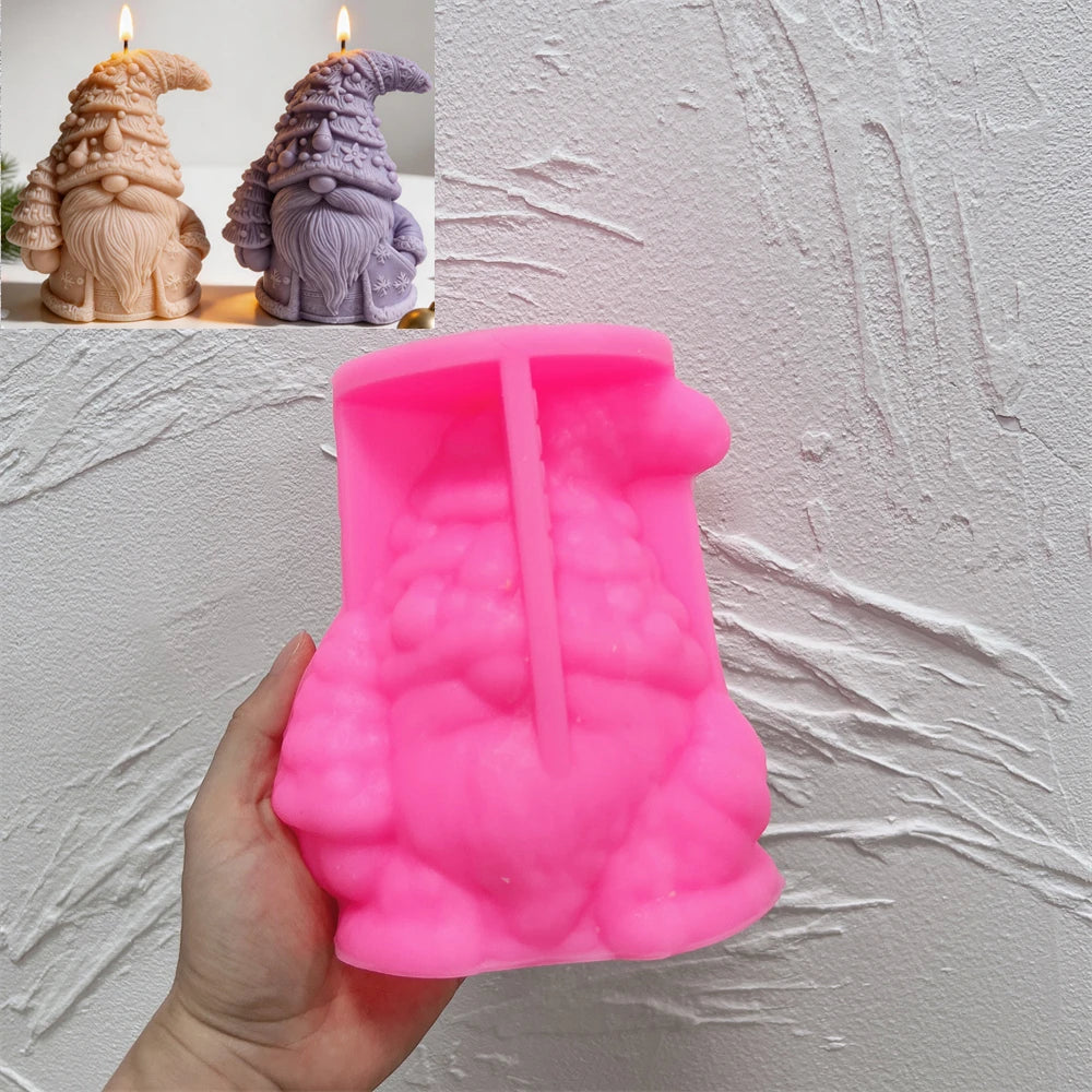 Pink silicone Christmas tree hat gnome mold beneath finished examples