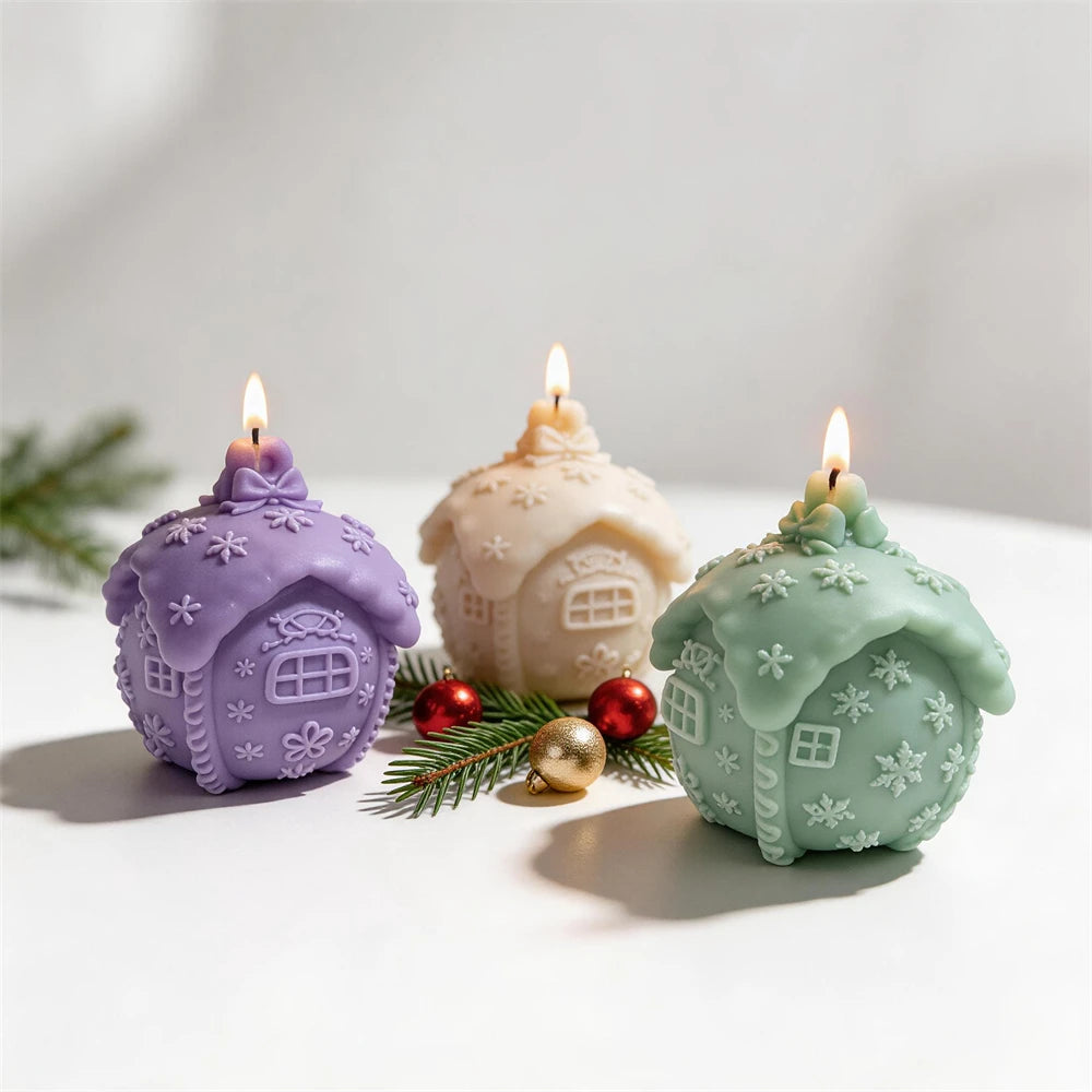 Rounded gingerbread cottage candles with snowflake roofs