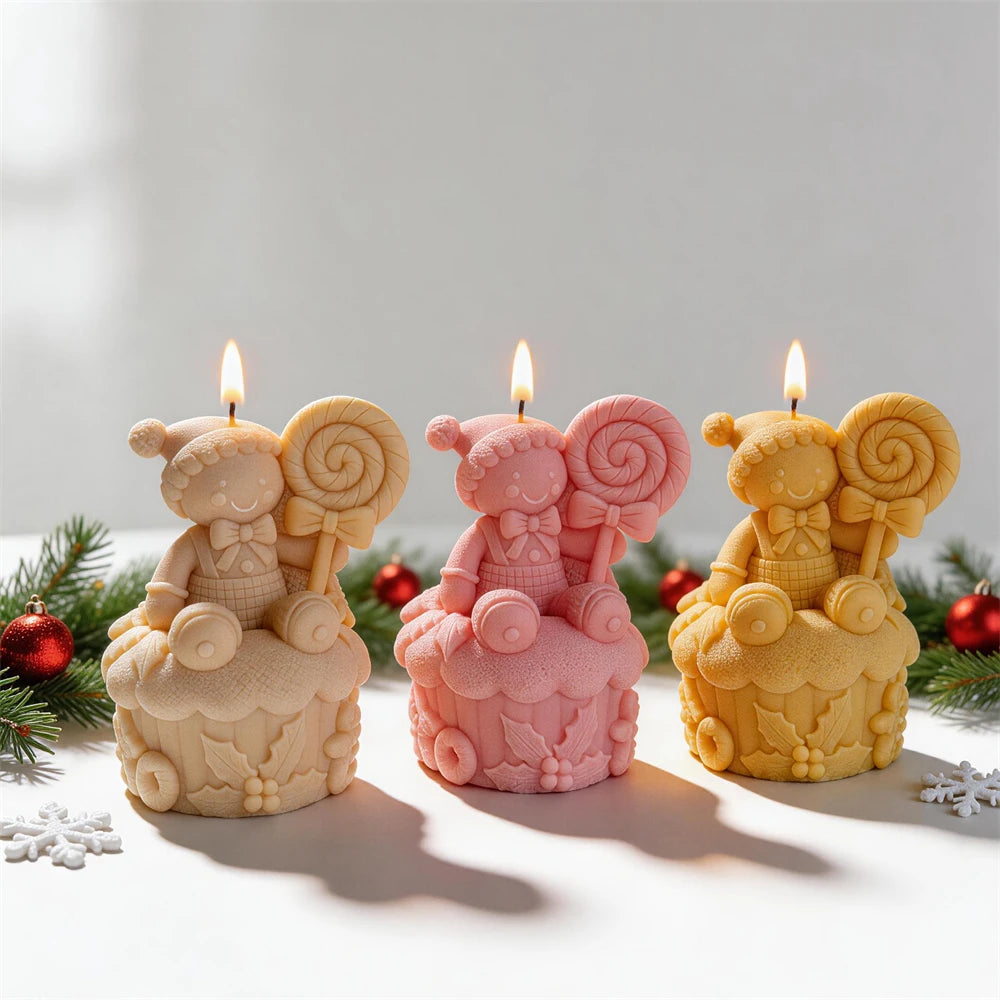 Cream pink and yellow gingerbread cupcake candles with spiral lollipops
