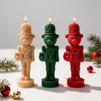 Three bear nutcracker soldier candles in cream, green and red with tall hats and uniform details