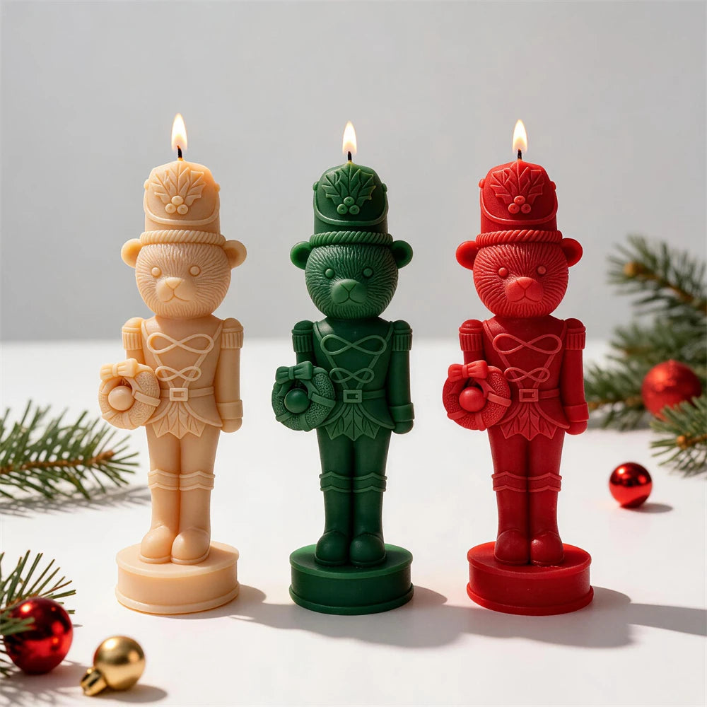 Three bear nutcracker soldier candles in cream, green and red with tall hats and uniform details