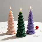 Pink green and lilac tree candles showing tapered pillar shapes