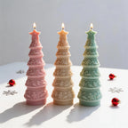 Pink, cream and green decorated tree candles with icing-style bands