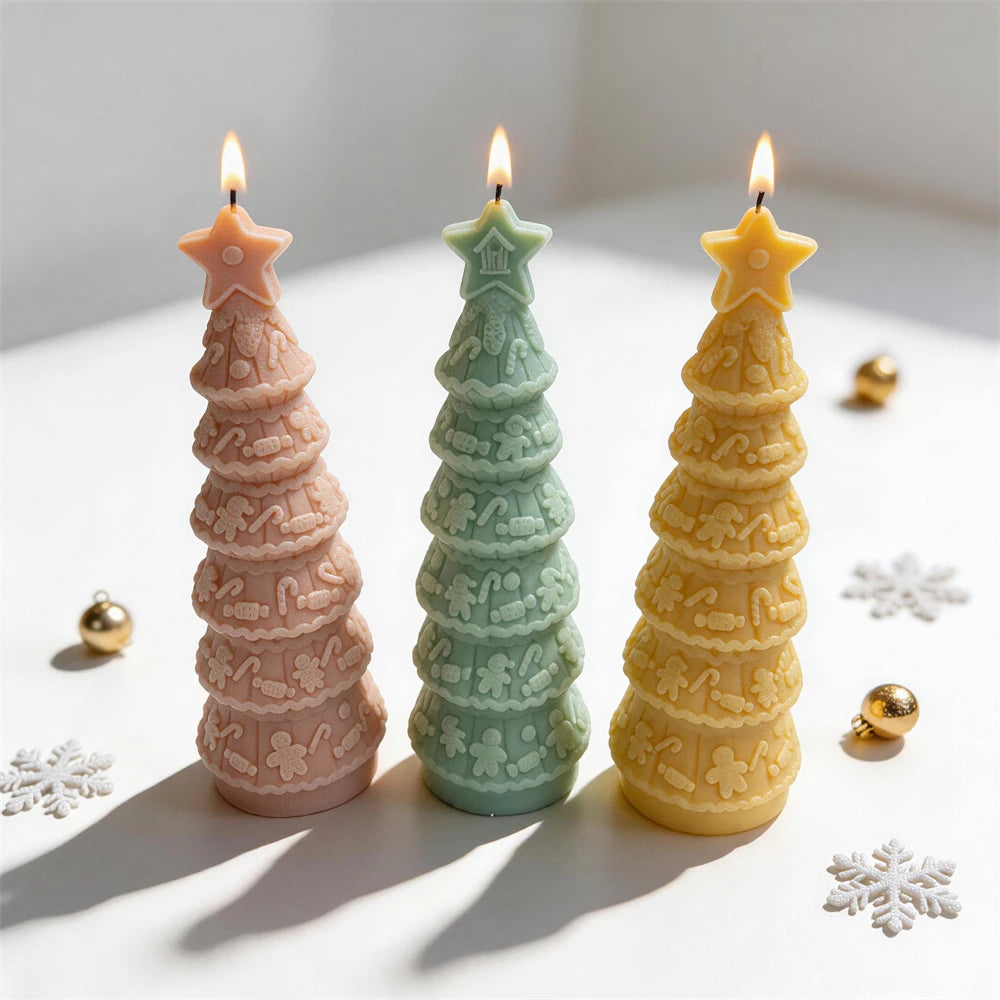 Three gingerbread garland tree candles casting long shadows