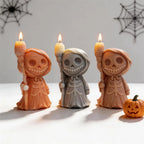Orange, gray and brown robed skeleton castings with brooms