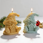 Cream and green seated gnome candles holding gingerbread houses
