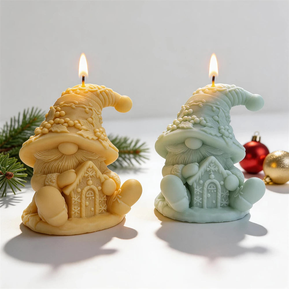 Cream and green seated gnome candles holding gingerbread houses