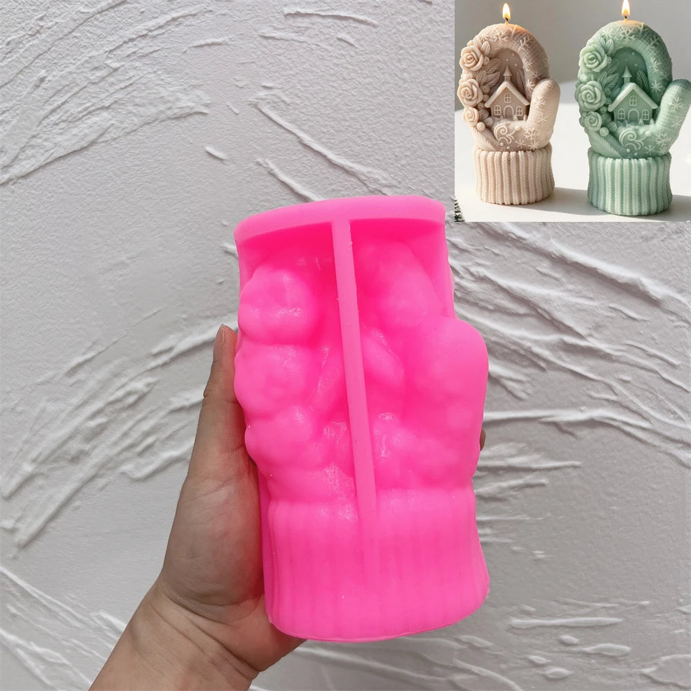Pink silicone cottage mitten mold held upright in a hand beside finished candles