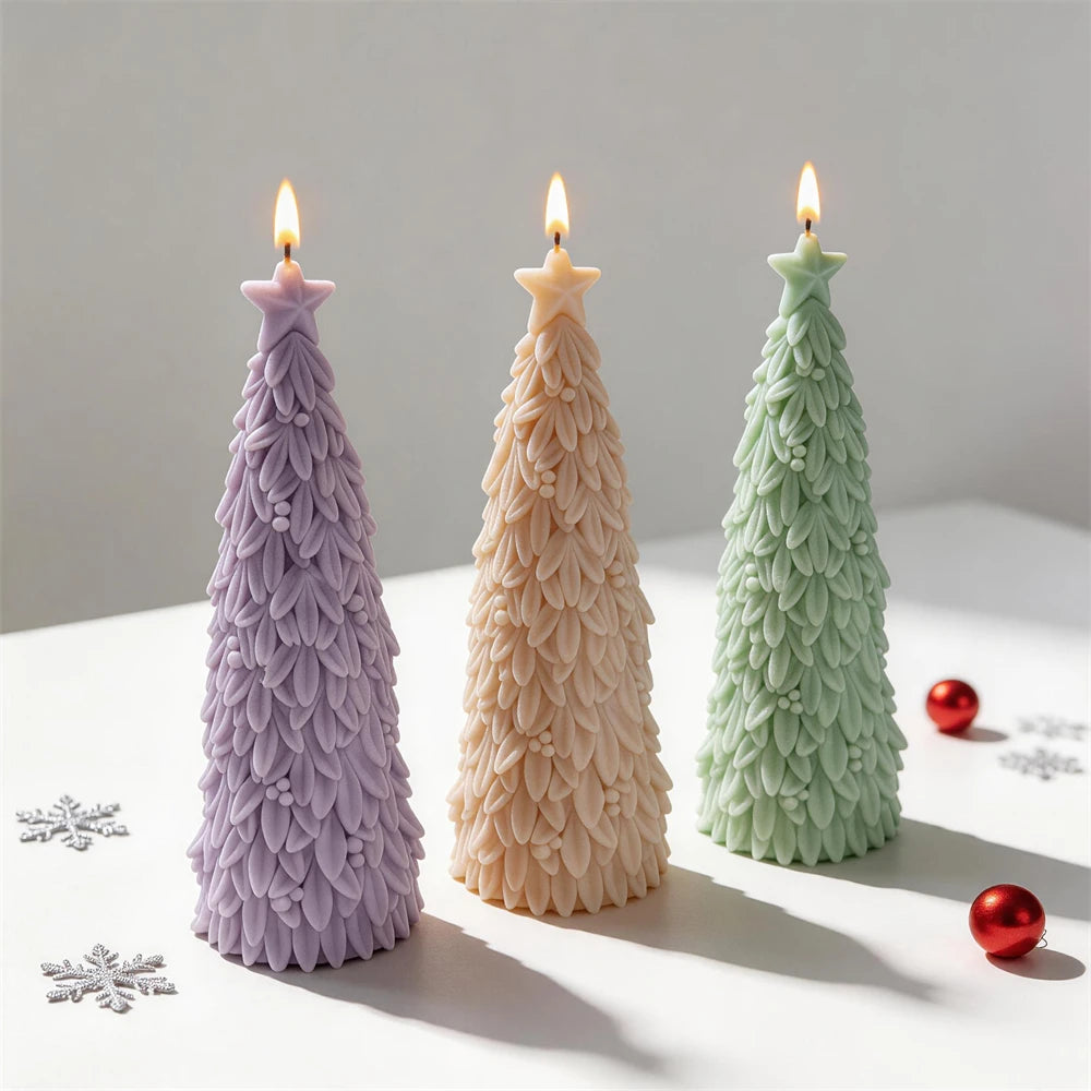 Three star topped tree candle samples with layered foliage