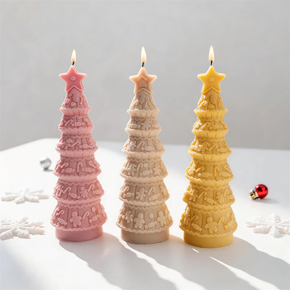 Decorated tree candles with gingerbread figures and scalloped garland bands