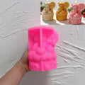 Pink silicone mold for gingerbread cupcake and lollipop scene