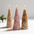 Poinsettia-style tree candles with clustered pointed floral relief