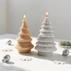 Cable Knit tree candle beside a Loop Knit tree with wider branch layers