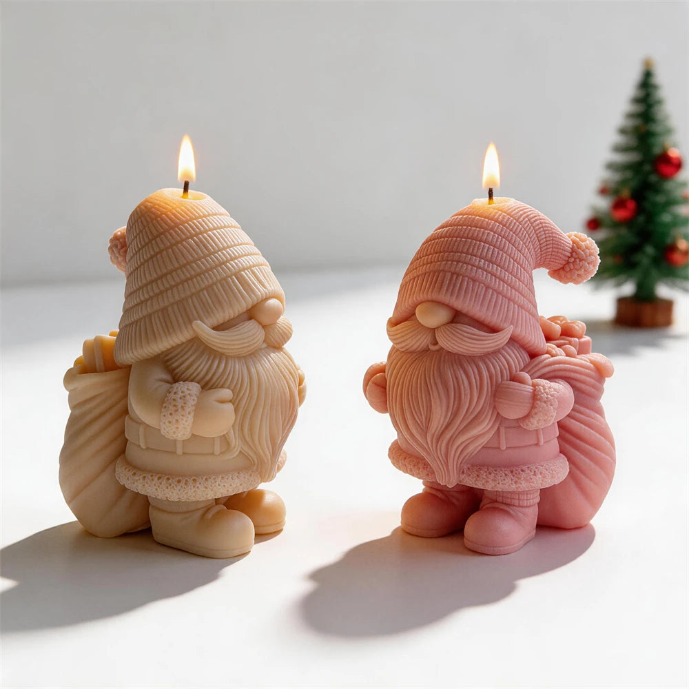 Two gnome candles showing beards, mittens and gift sacks