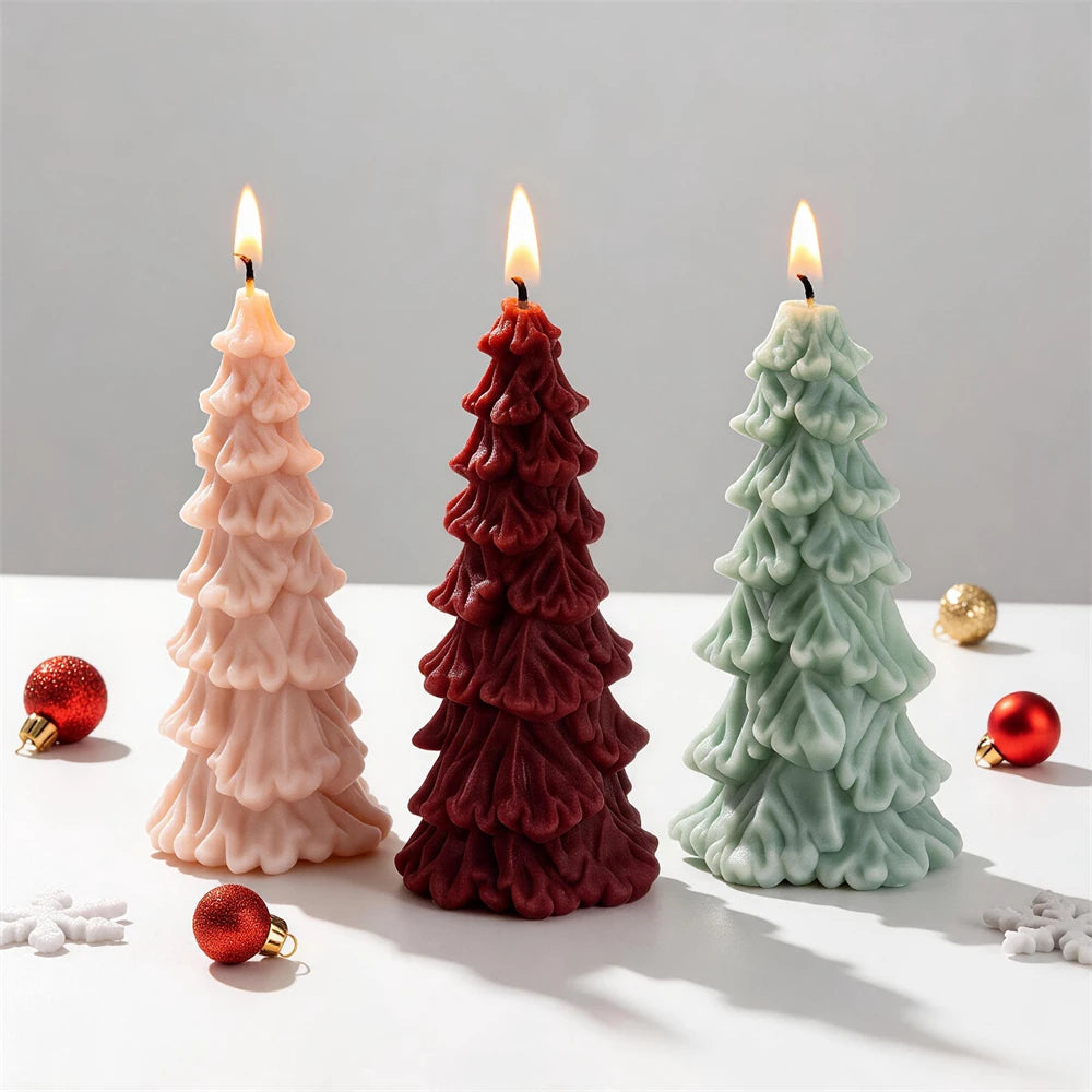 Pink red and green Christmas tree candles with drooping branch tiers