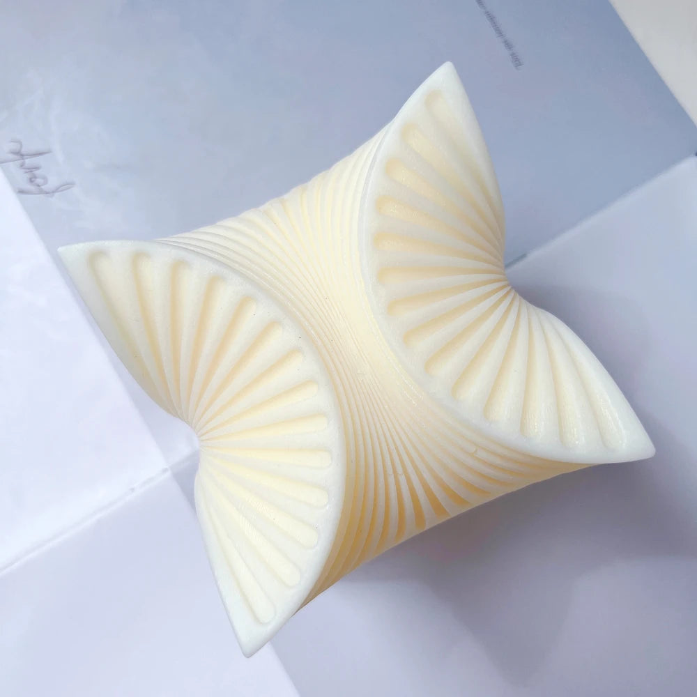 Top view of sculptural swirl with fine radiating ribs