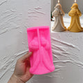 Pink silicone mold for detailed long-robed Santa Claus candle