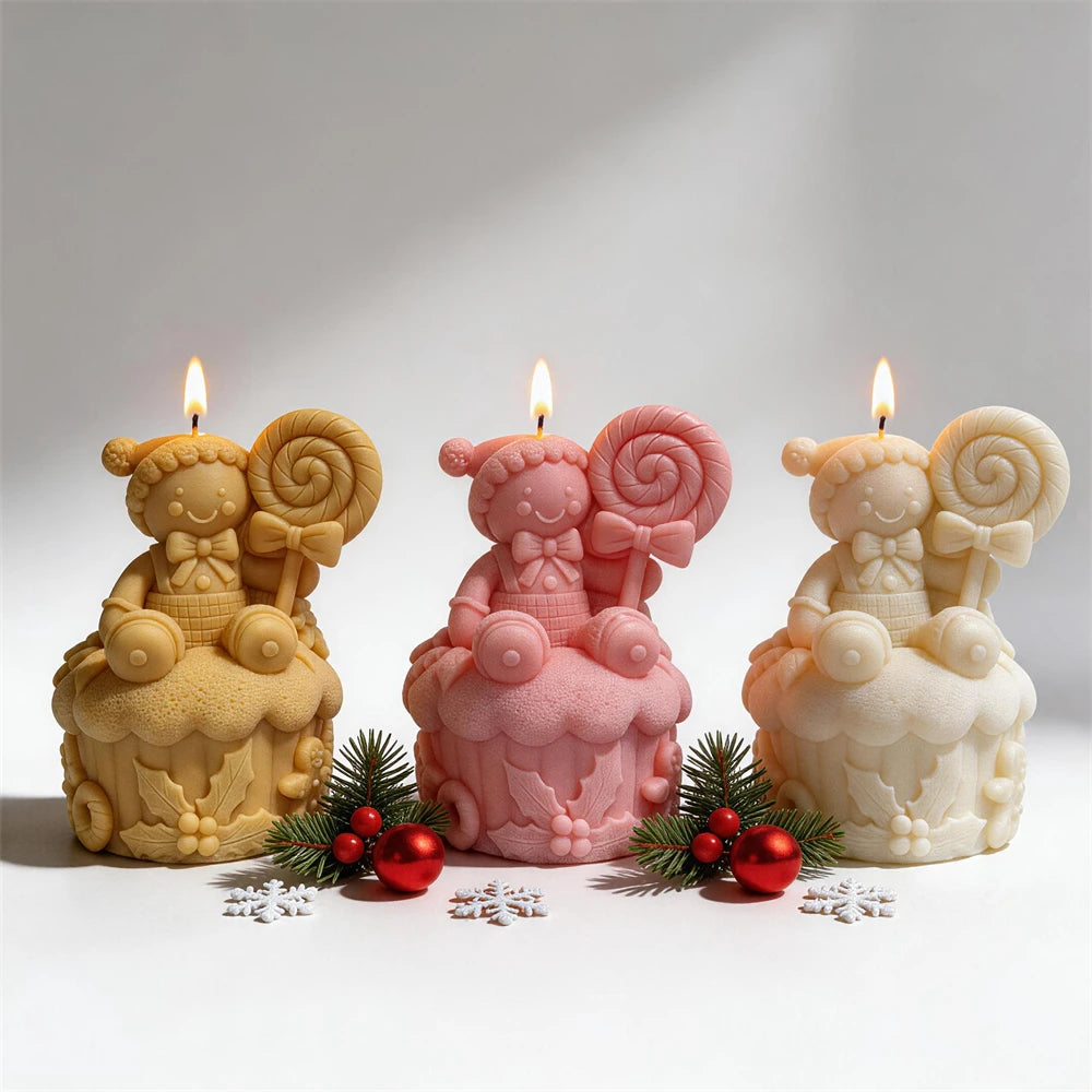 Three cupcake candles with winter hats and lollipop details