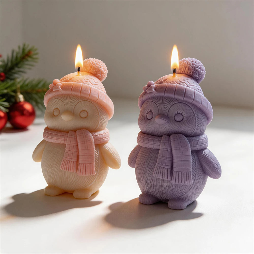 Pink and purple winter bird candles with hats and small wings