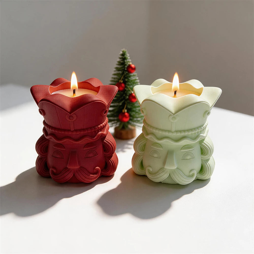 Red and green nutcracker head vessels displaying sculpted faces