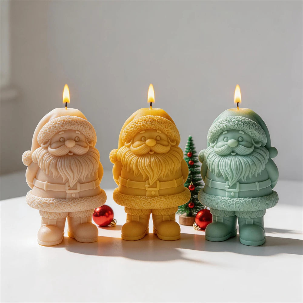 Santa candle group beside miniature Christmas trees and ornaments