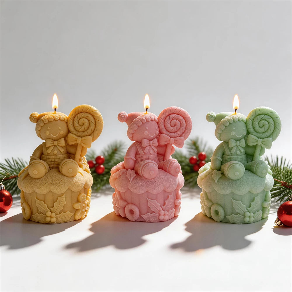 Yellow pink and green gingerbread figures seated on cupcake bases