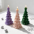 Three star-topped Christmas tree castings with flared tiers