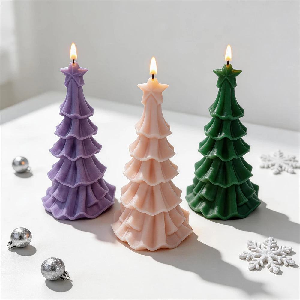 Three star-topped Christmas tree castings with flared tiers