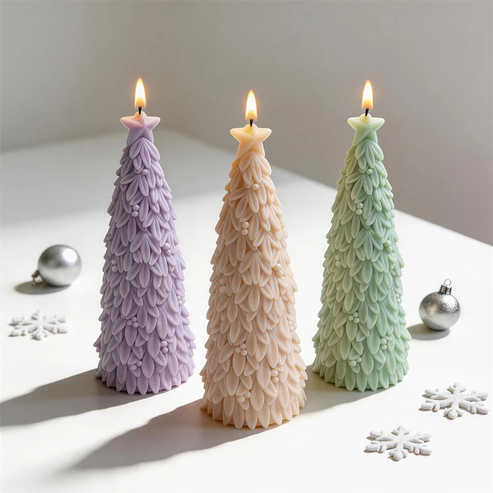 Angled star topped fir tree candles beside festive ornaments