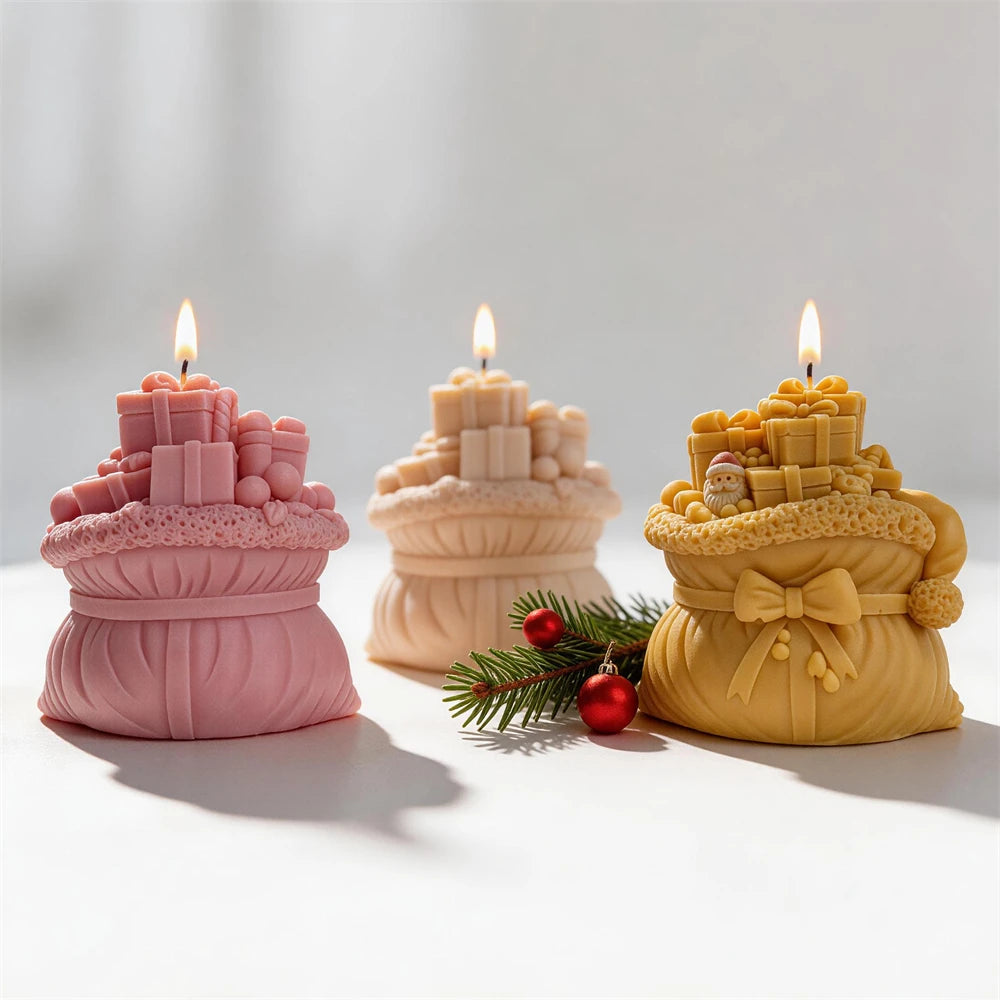 Rear view of Christmas gift-sack candles with gathered bag folds