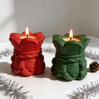 Red and dark green nutcracker vessels beside Christmas decorations