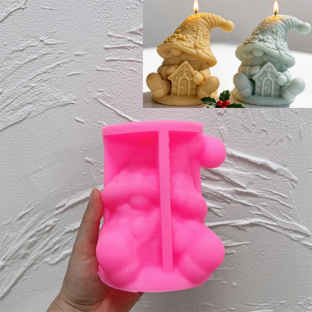 Pink silicone sitting gnome mold beneath finished candle examples