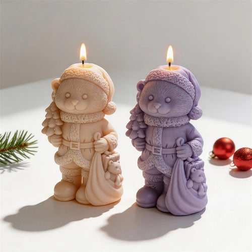 Two festive bear candles in belted coats and boots