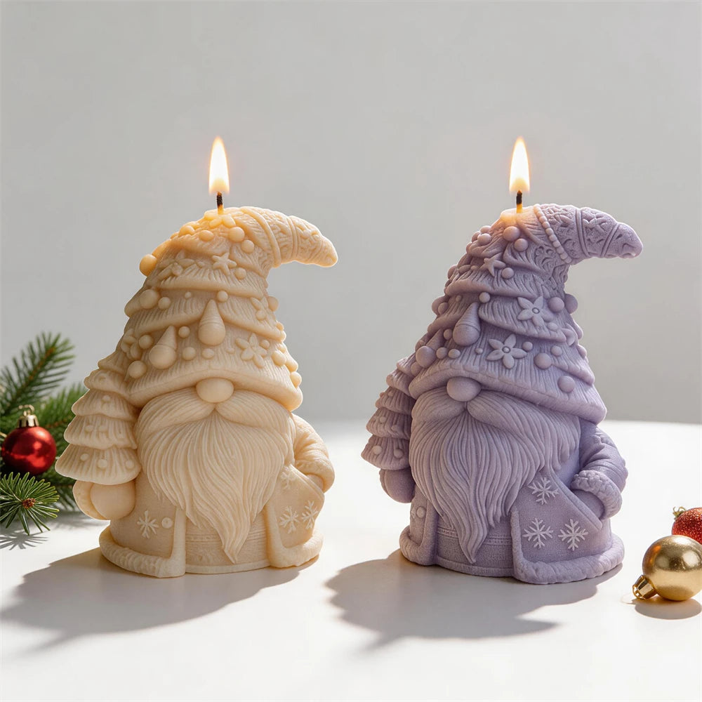 Two Christmas gnome candles showing layered hats and long beards