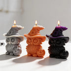 Angled front view of Halloween owl candles and connected pumpkins