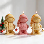 Cream pink and yellow winter character castings on round bases