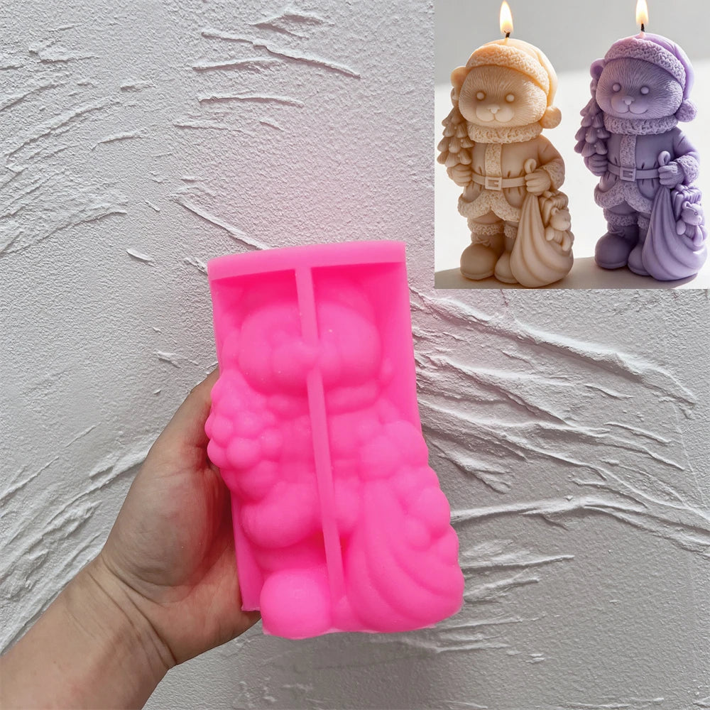 Pink silicone Christmas bear mold held beneath finished examples
