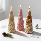 Three slender flower-covered Christmas tree candle samples