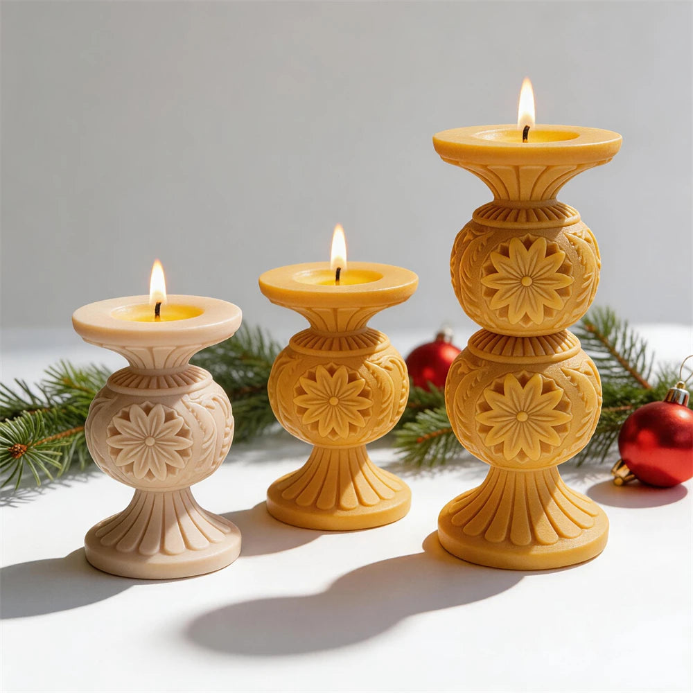 Single and double globe snowflake candles with fluted bases in cream and gold