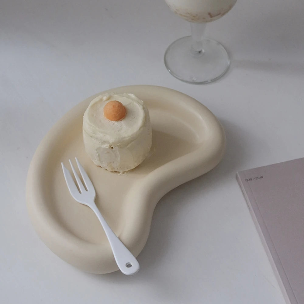Cream organic tray casting with a raised rim and staged dessert