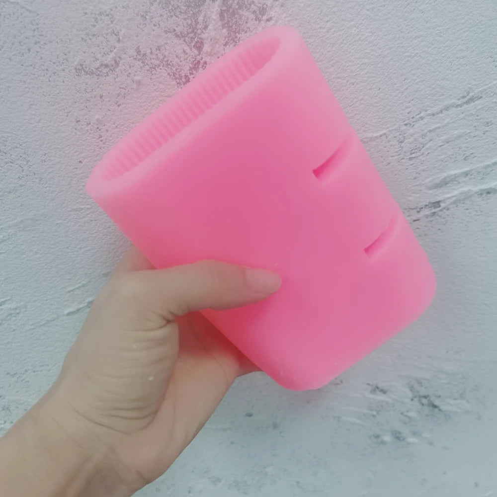 Pink E letter silicone mold held in one hand