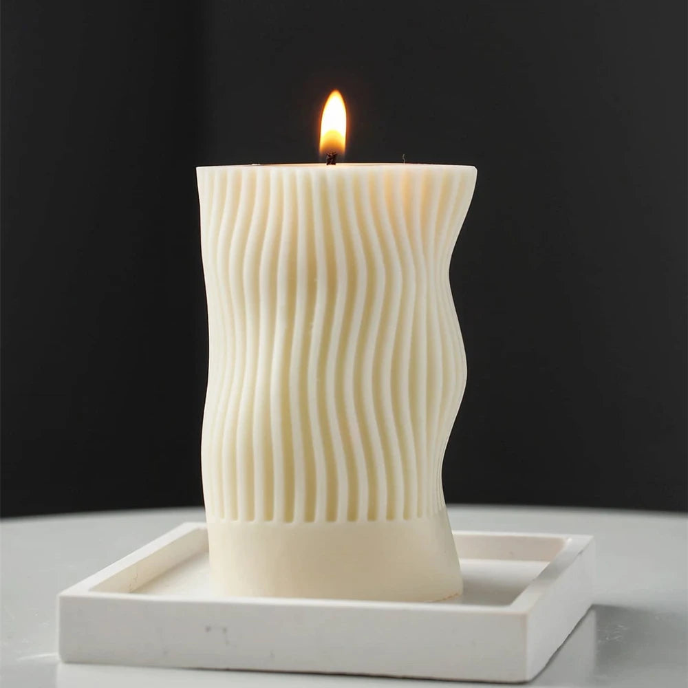 Front view of a lit wavy cylindrical pillar