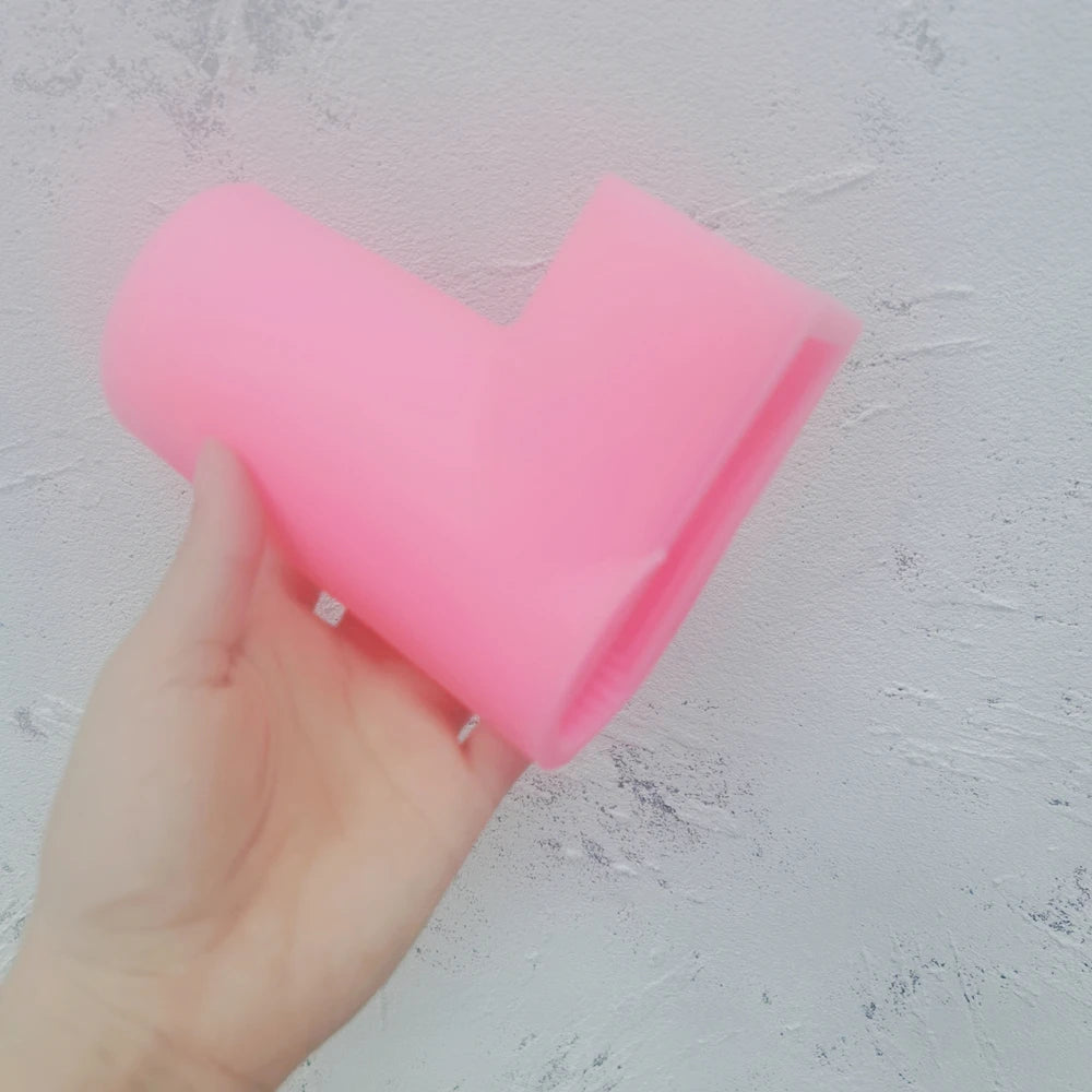 Pink L letter silicone mold held in one hand